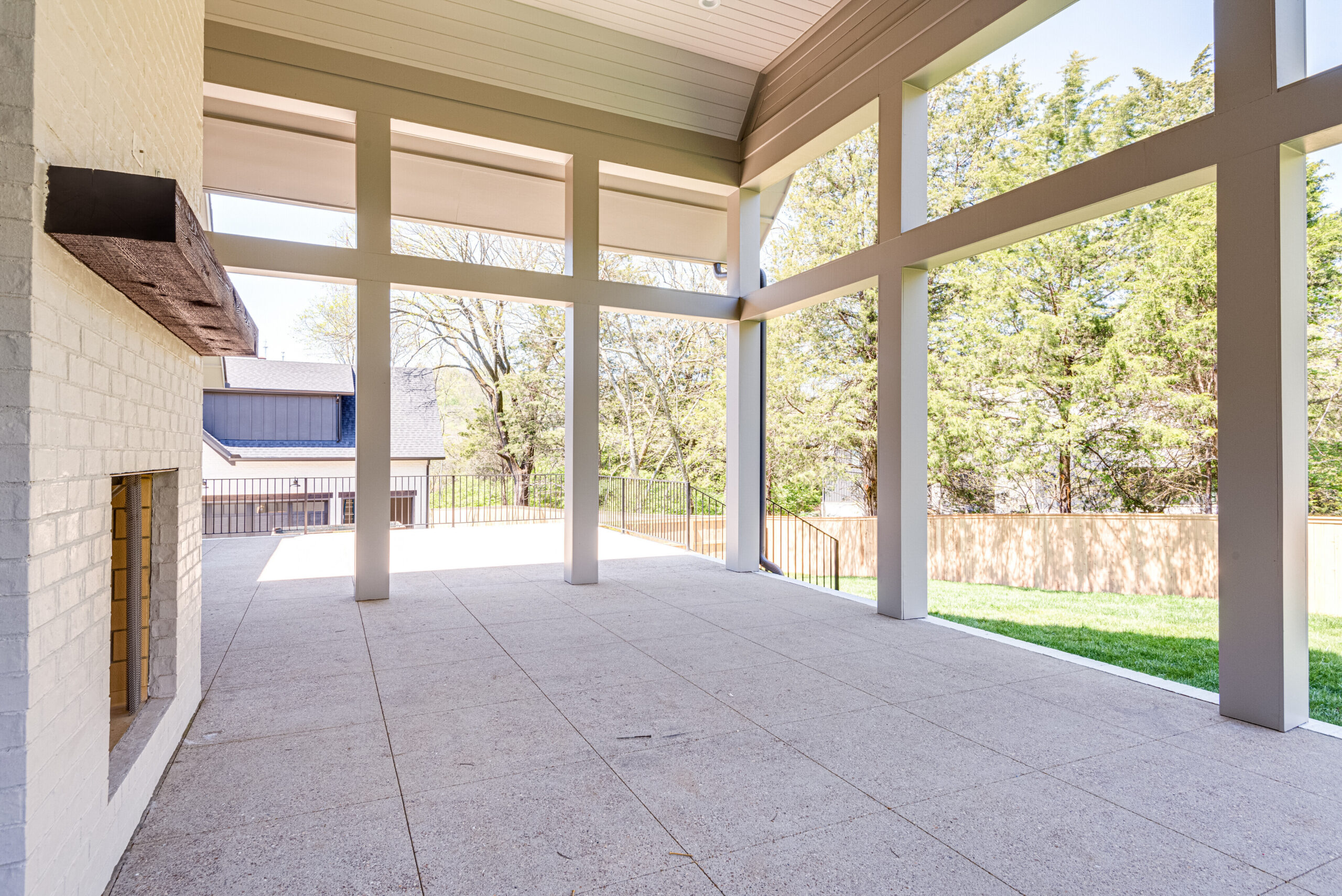 Covered back patio with high ceilings