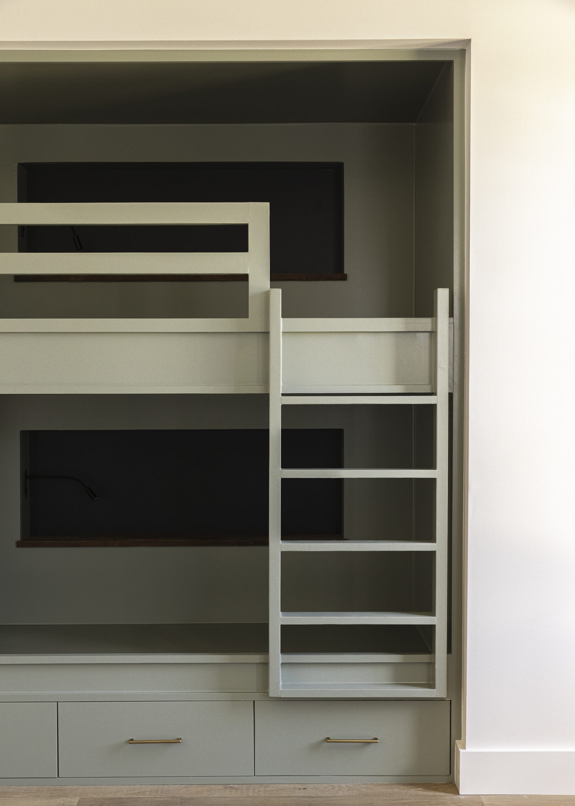 Double, sage green bunk beds with drawers below