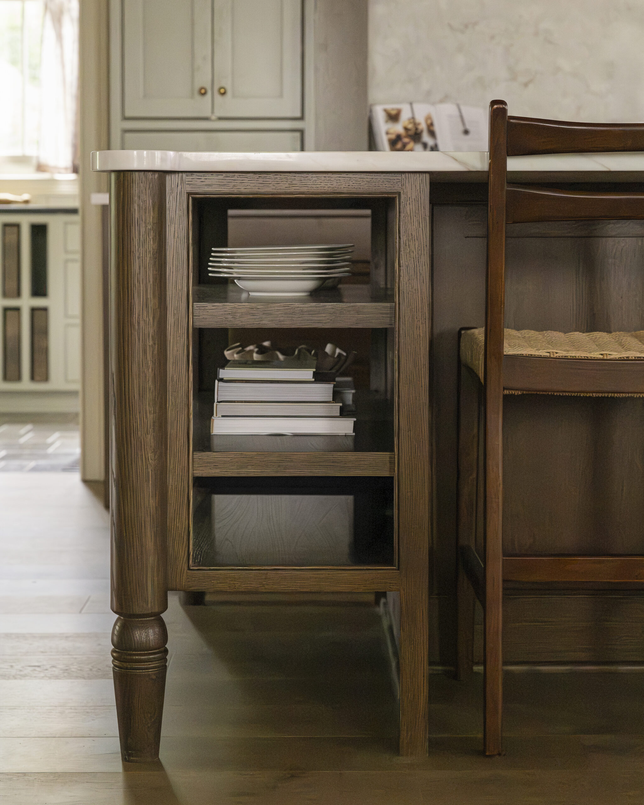 Dark wood stained kitchen island with open shelving at end