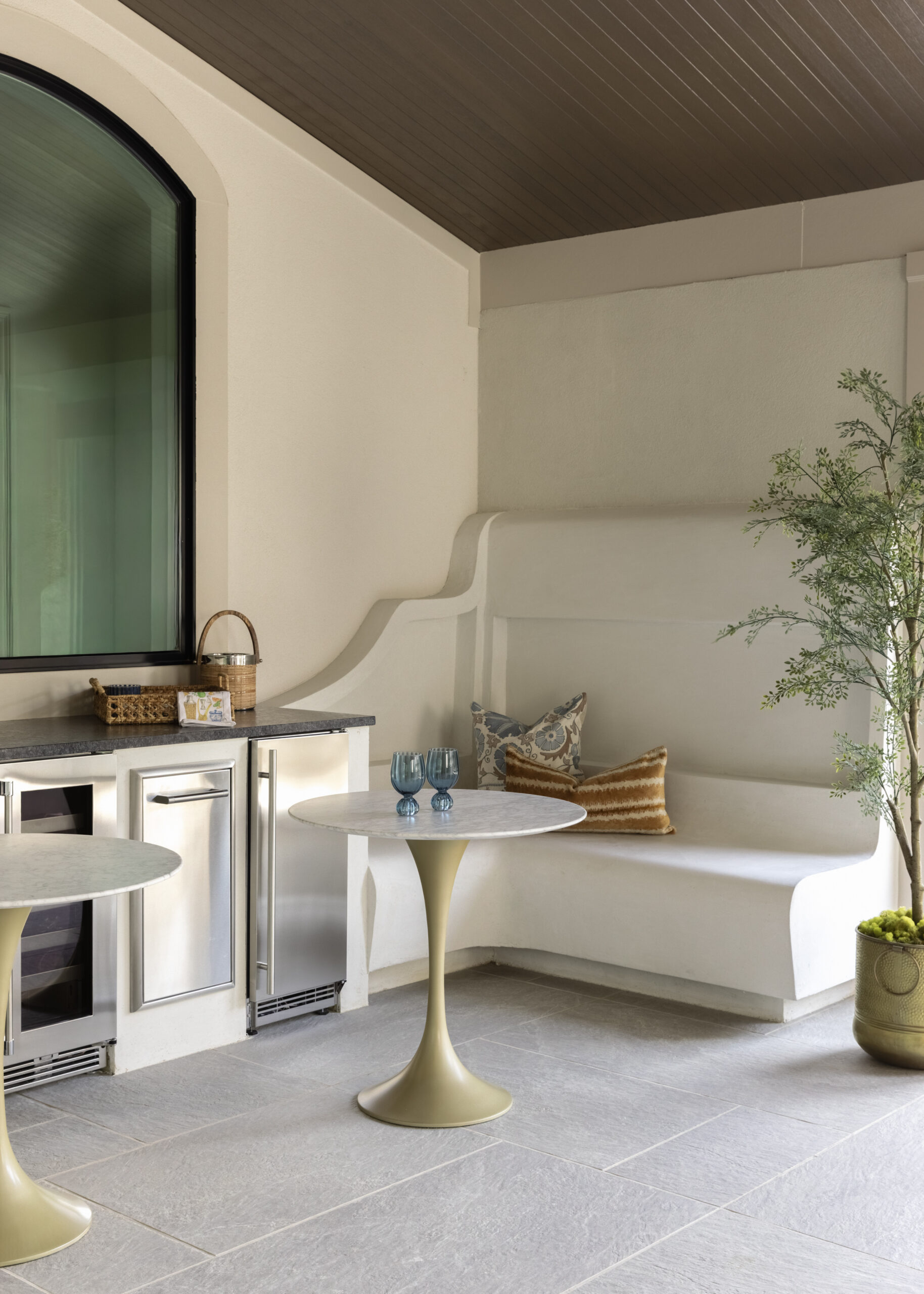 Back patio with large window and stucco built-in seating
