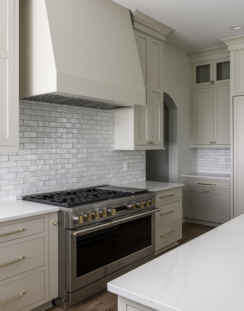 Beige kitchen cabinets with kitchen range