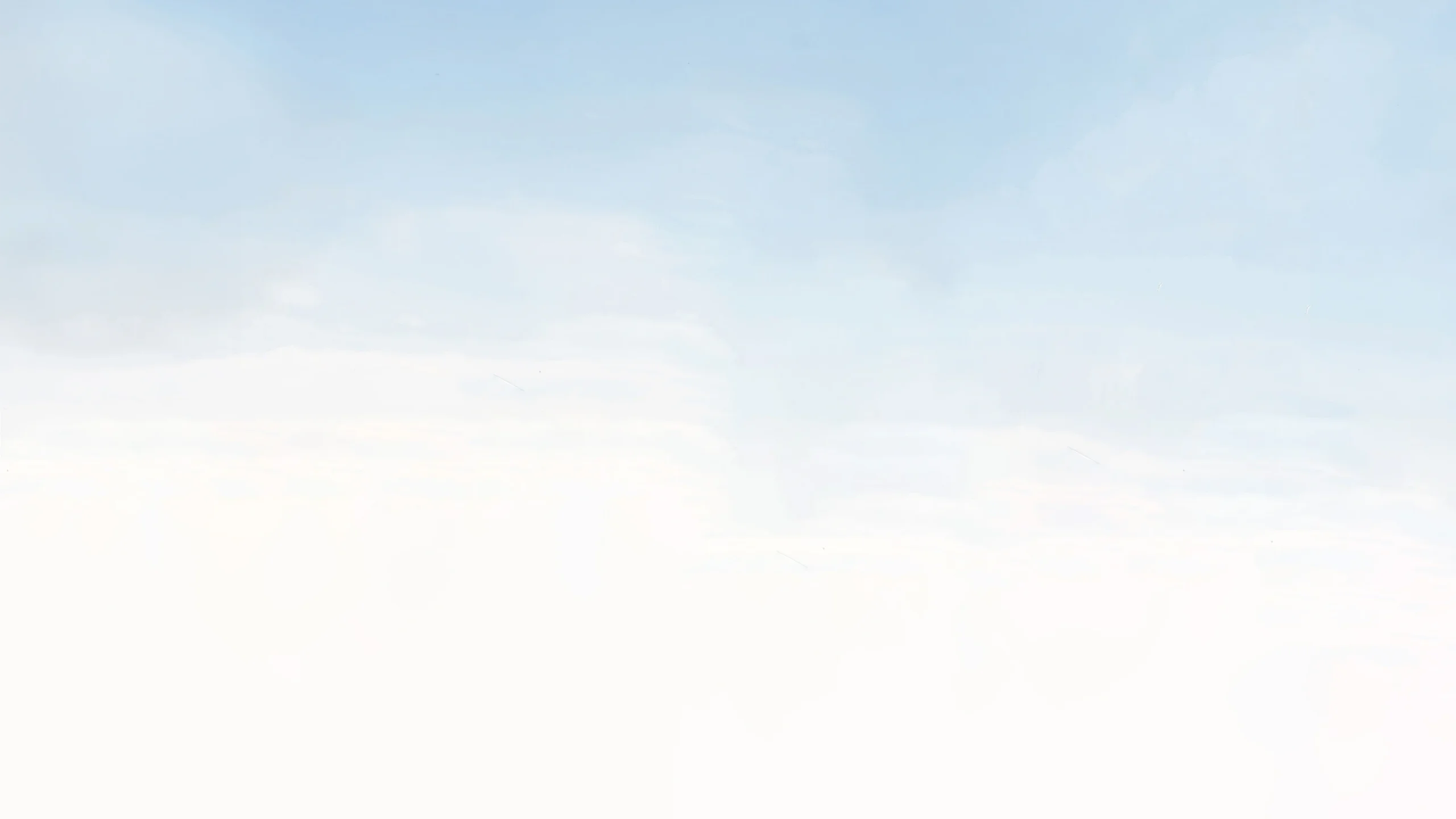 Soft blue sky with light clouds, used as a hero background layer
